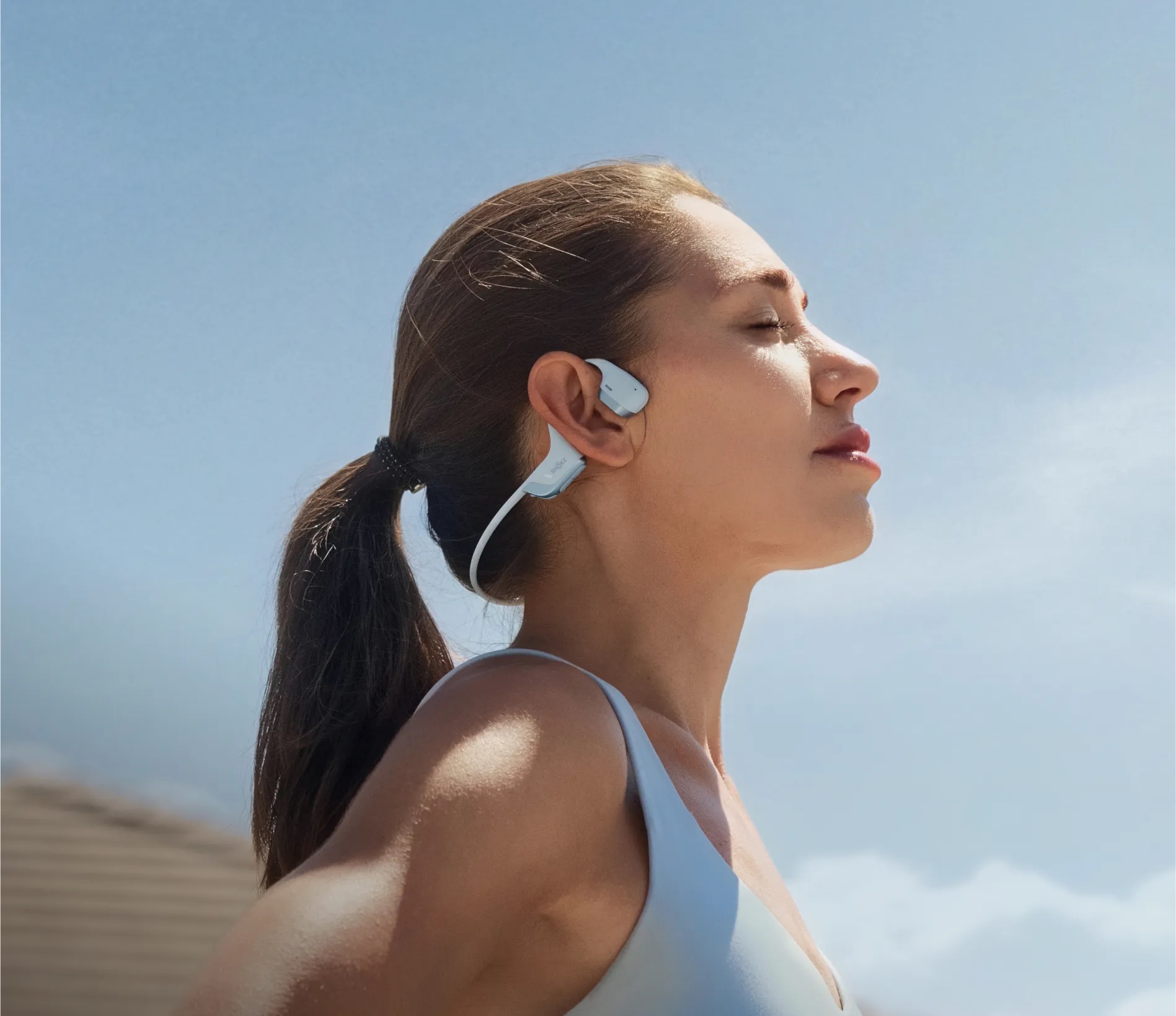 Runner wearing open-ear headphones
